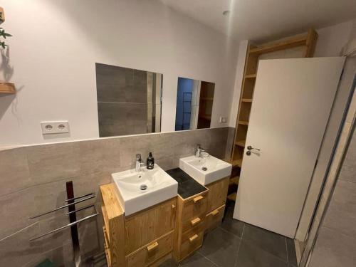 a bathroom with two sinks and a mirror at House in Sant Cugat, 25 Mins to Barcelona center in Sant Cugat del Vallès