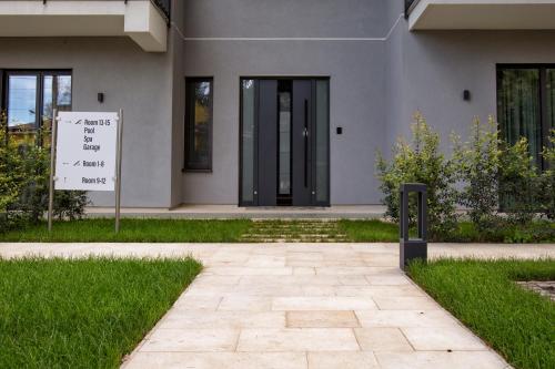 a building with a sign in front of it at Villa Rita Pool & Spa in Mascalucia