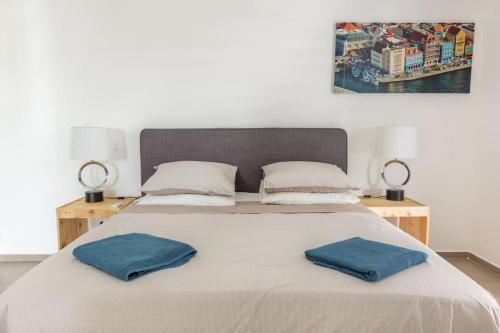 Voodi või voodid majutusasutuse Goudhaen Luxury Private apartments Jan Thiel Beach toas