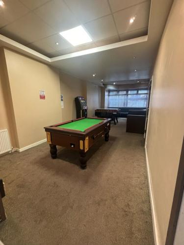 an empty room with a pool table in it at The Lawton in Blackpool