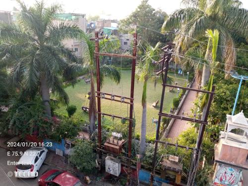 an aerial view of a park with palm trees at Hotel chappan indori in Indore