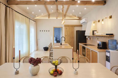 a kitchen and dining room with a table and chairs at Villa Alma 1910 Starosel in Starosel