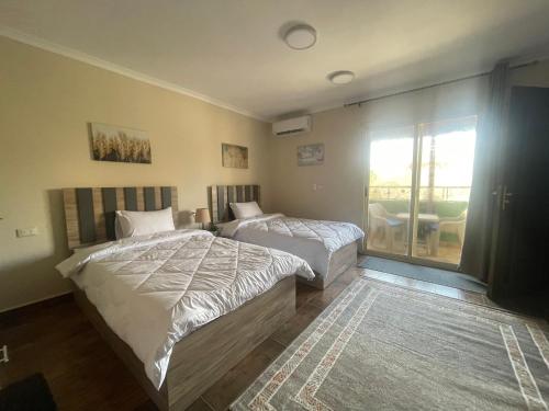 Voodi või voodid majutusasutuse Malek Pyramids Guest House toas