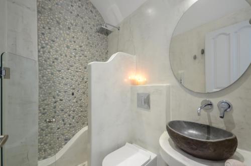 a bathroom with a sink and a mirror at Sofi pension in Naxos Chora