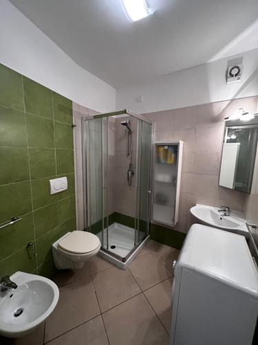 a bathroom with a shower and a toilet and a sink at Casa Vacanze con piscina - Caorle in Porto Santa Margherita di Caorle