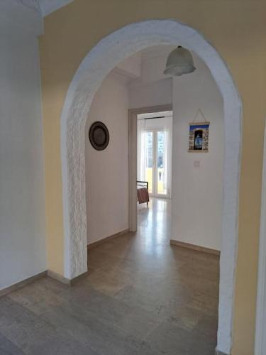 a hallway with an archway in a house at ENDLESS VIEWS PANTELI LEROS in Panteli