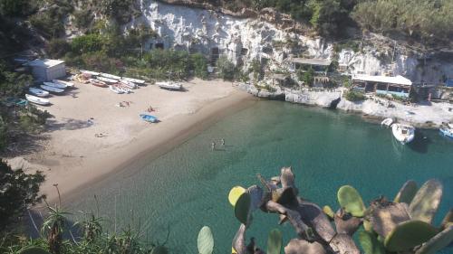 a view of a beach with people in the water at Oasi del mare in Ponza
