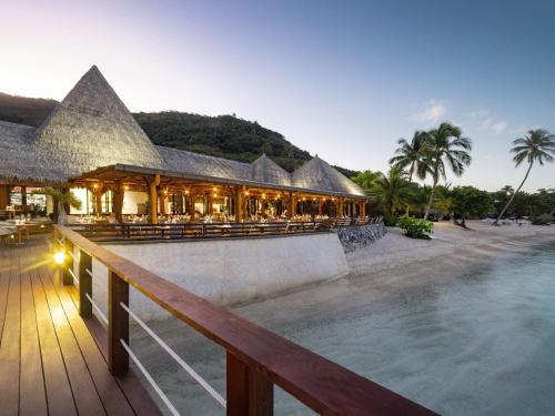 a resort with a pool in front of a building at Sofitel Kia Ora Moorea Beach Resort in Maharepa