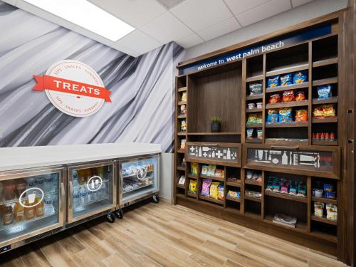 a treats section of a store with shelves of products at Hampton Inn West Palm Beach-Florida Turnpike in West Palm Beach