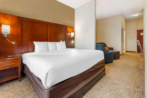 a large white bed in a hotel room at Comfort Suites Wilson - I - 95 in Wilson