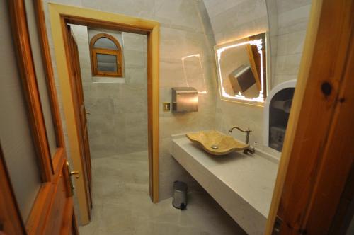 a bathroom with a sink and a shower at Hotel Kral Boutique in Ürgüp