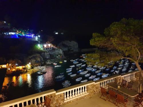 a group of boats docked in a marina at night at Oasi del mare in Ponza