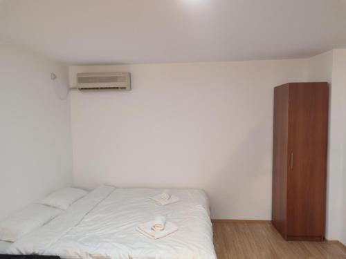 Un ou plusieurs lits dans un hébergement de l'établissement Apartmani Hub