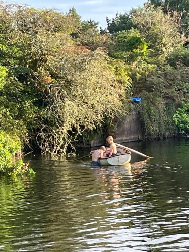 a young boy in a boat on the water at Tresahor Studio in Falmouth