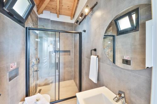 a bathroom with a shower and a sink at Villa Çıtıpıt in Kas