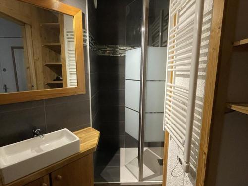 a bathroom with a sink and a refrigerator at Studio rénové avec 2 couchages et internet, proche pistes et funiculaire - FR-1-292-203 in Isola