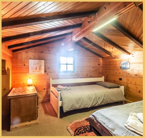 a bedroom with a bed and a table in a room at Sublime Chalet T5 Les Gets in Les Gets