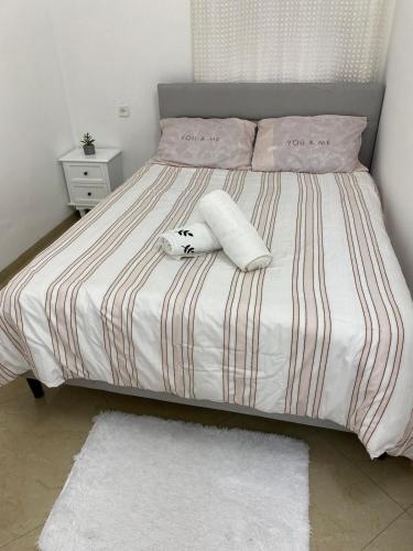 a bed with two towels and a stuffed animal on it at בקתת אברהם in Safed