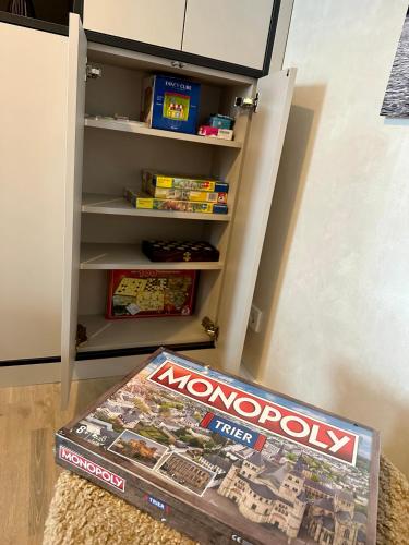a lego box sitting on the floor next to a book at Modern Elegance in historical City Center in Trier