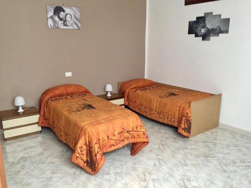 Giường trong phòng chung tại Casa Mia