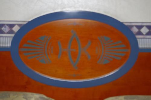 a close up of a bowl with the letter k on it at Hotel Kroma in Ragusa