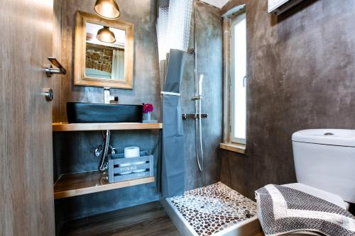 a bathroom with a sink and a shower at Villa Nicola in Kissamos