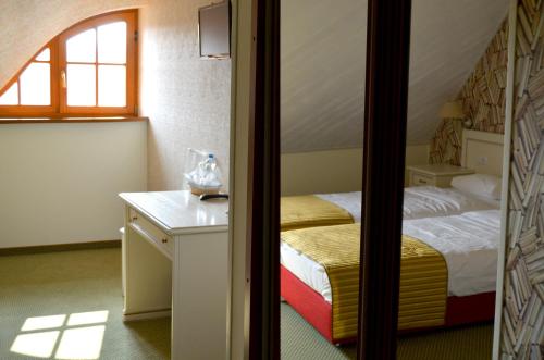 Postel nebo postele na pokoji v ubytování KARPYNĖ Restaurant & Bed & Breakfast