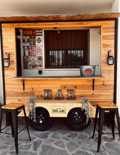 a tiny house with two chairs and a tv on top at Casa Rural Zahoko in Guadalajara