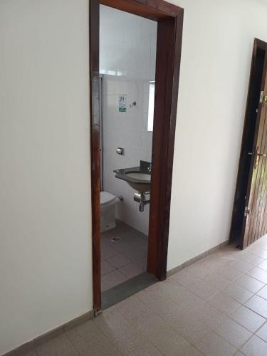a bathroom with a sink and a toilet in a room at Paz e descanso Chacara Meu Morrinho in Mairiporã