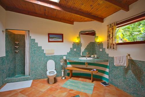 Ένα μπάνιο στο Coté Sud - Unique Villa & Bungalows Intendance Road