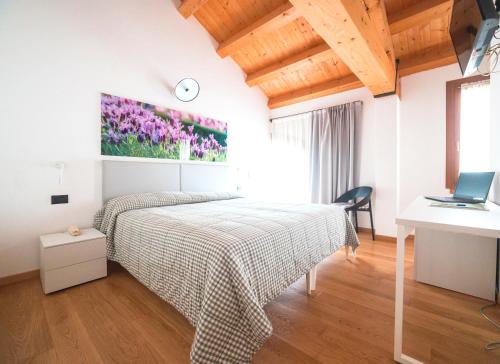 Una cama o camas en una habitación de Col Delle Rane