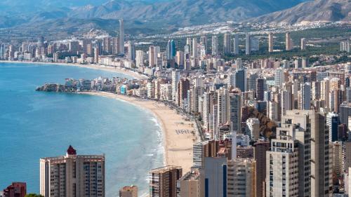 a view of a city with a beach and buildings at Luxury apartment Residencial Sunset Drive - Benidorm, España in Benidorm