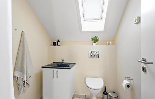 a bathroom with a sink and a toilet at 3 Bedroom Amazing Apartment In Bogense in Bogense