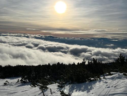 a view from the top of a mountain of clouds at Štrbské Pleso Apartmán Oliver #40 in Štrbské Pleso