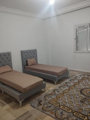 Un ou plusieurs lits dans un hébergement de l'établissement Appartement Jad