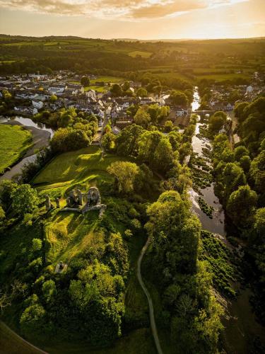 an aerial view of a town with a river at House of Brohedyn in Newcastle Emlyn
