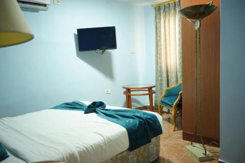 Postel nebo postele na pokoji v ubytování Conord Hotel
