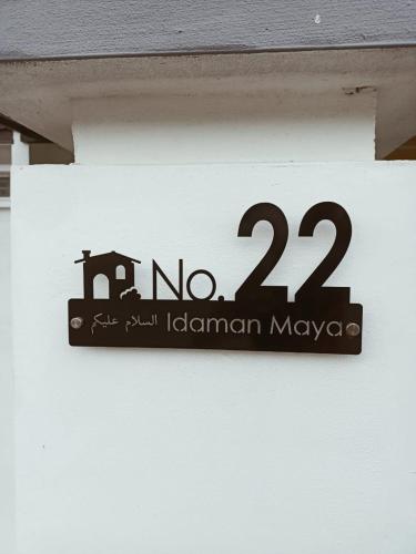 Un certificado, premio, letrero u otro documento en Idaman Maya