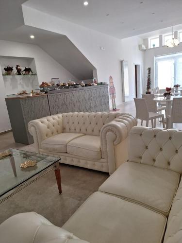 a living room with a couch and a table at B&B Le Torri in Santeramo in Colle