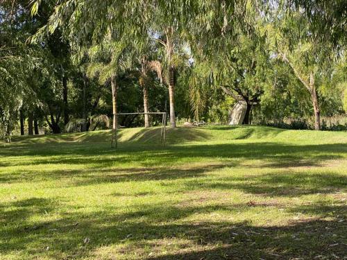 a field of green grass with a soccer goal at Cabañas El Tercer Ojo Tigre in Tigre