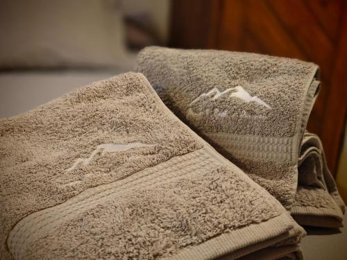 two towels are laying on top of each other at Peace & Rest in Pirineus in Latour-de-Carol