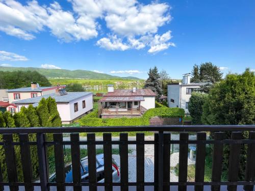 a view of a house from a balcony at Chata pri jazere Nitrianske Rudno in Nitrianske Rudno