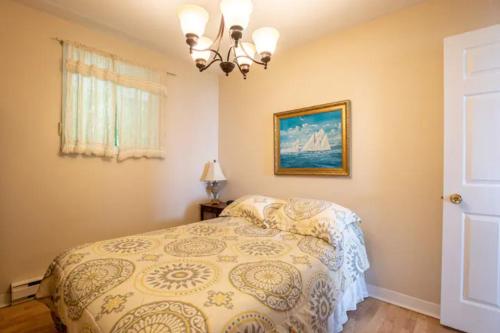 Кровать или кровати в номере Les chalets labbé