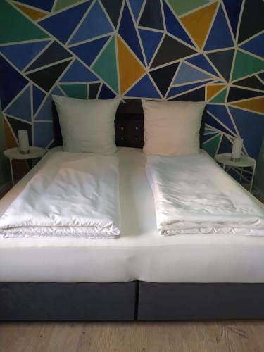 Säng eller sängar i ett rum på Ferienwohnung in Niedraula