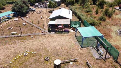 an aerial view of a play park with a playground at Cabañas Vista Hermosa Radal 7 Tazas in El Torreón