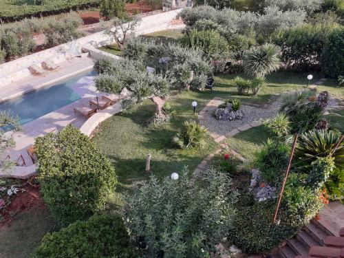 an aerial view of a garden with plants and a swimming pool at Holiday Home Cosimo in Locorotondo