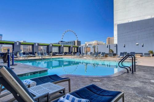 a swimming pool on the roof of a building at Luxury 1BD/1BTH Suite at Platinum Hotel *STRIP VIEW in Las Vegas