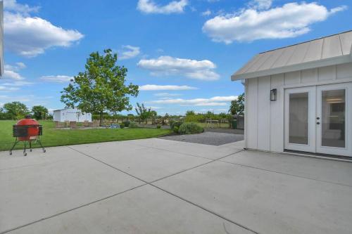 a building with a grill in front of it at The Modern Farmhouse in Yuba City