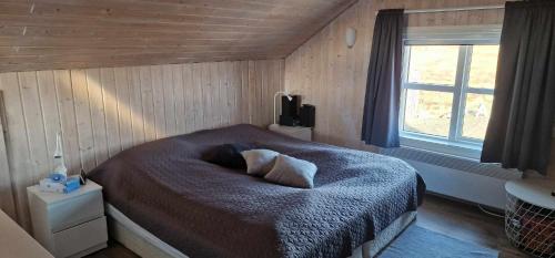 Un pat sau paturi într-o cameră la Berghof