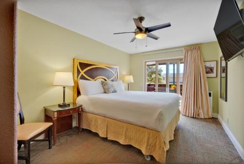 a bedroom with a large bed and a window at Bodega Bay Inn in Bodega Bay